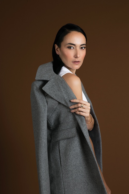 Lisa S wears coat and top by Carven and jewellery by Van Cleef & Arpels